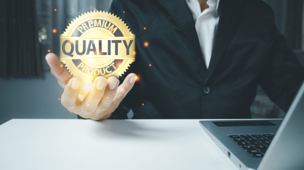 Quality product symbol in the hand of a business man.